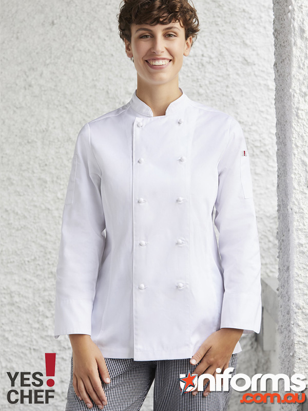 A woman in a chef's jacket, showcasing the 'Yes Chef! Al Dente Ladies LS Chef Jacket' with a confident expression.